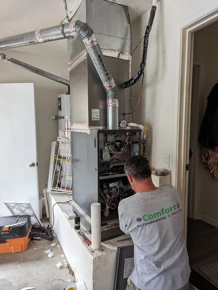 Benefits of Professional HVAC Duct Cleaning 2 Technician cleaning HVAC ducts to improve energy efficiency and reduce costs